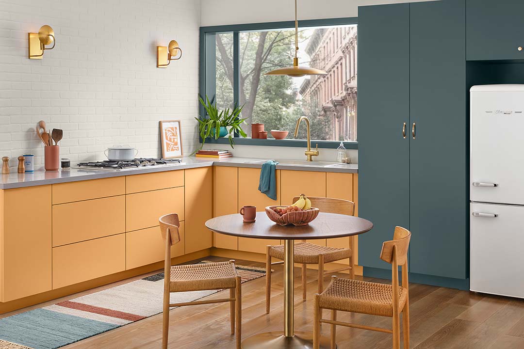 orange cabinets in multi hue kitchen